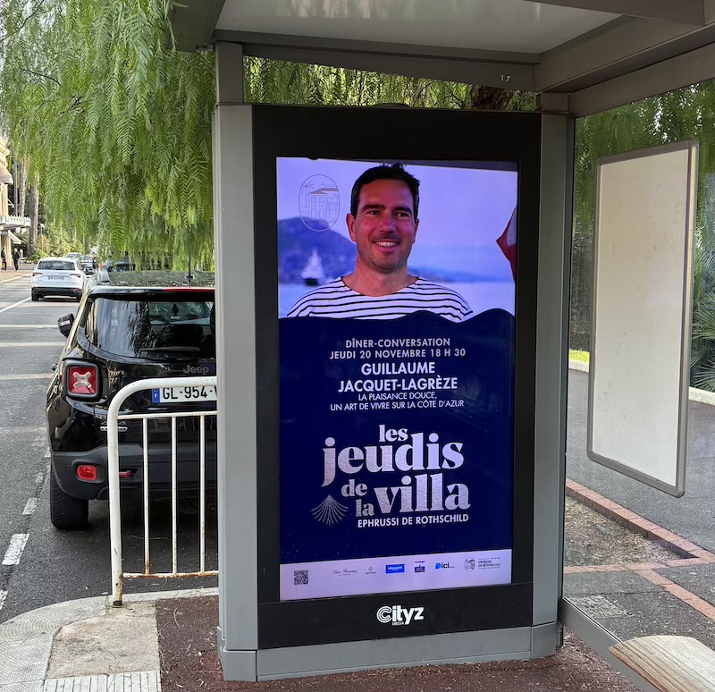 Outdoor poster for 'Les Jeudis de la Villa' event on a city street.