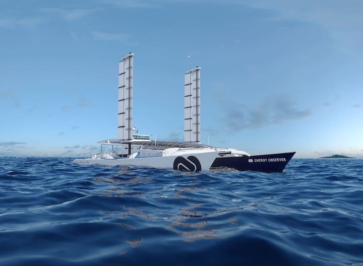 Futuristic boat with two vertical sails on ocean.