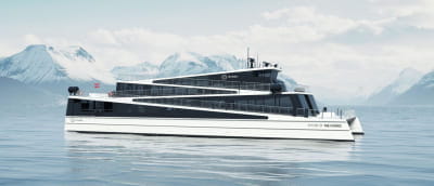 Modern ferry on a calm sea with snow-capped mountains in the background.